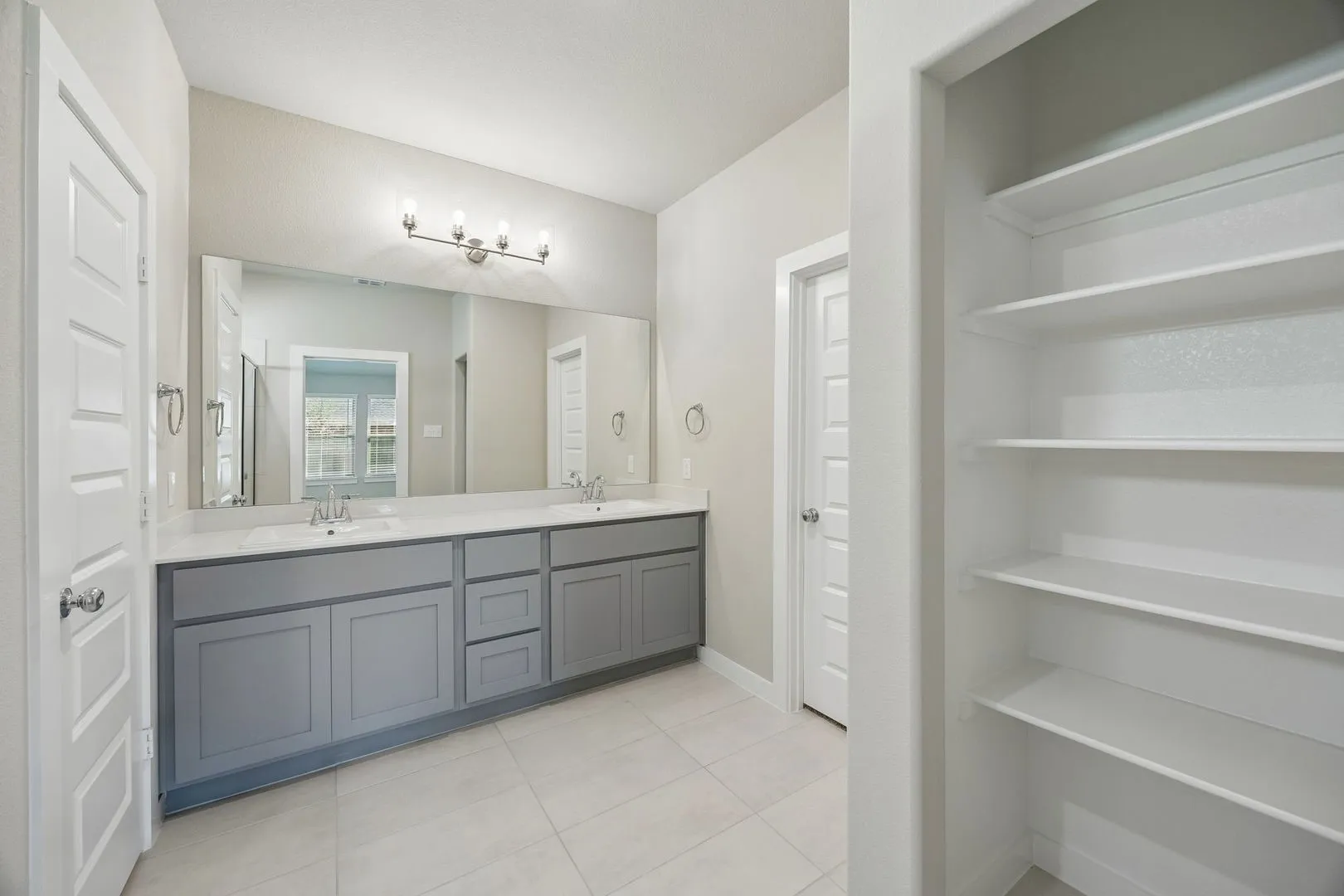 Primary Bathroom in the Emmy II home plan by Trophy Signature Homes - REPRESENTATIVE PHOTO