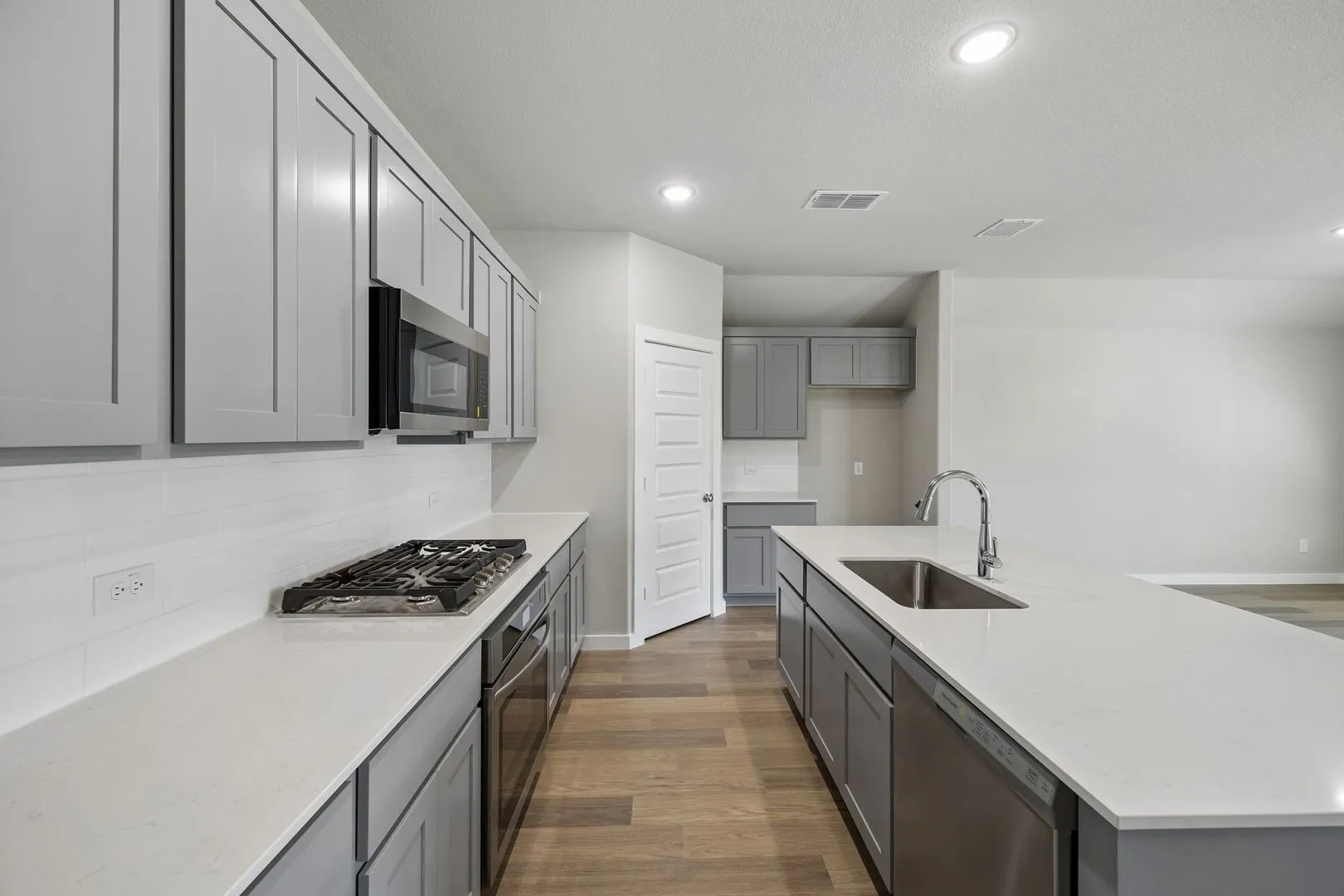 Kitchen in the Emmy II home plan by Trophy Signature Homes - REPRESENTATIVE PHOTO