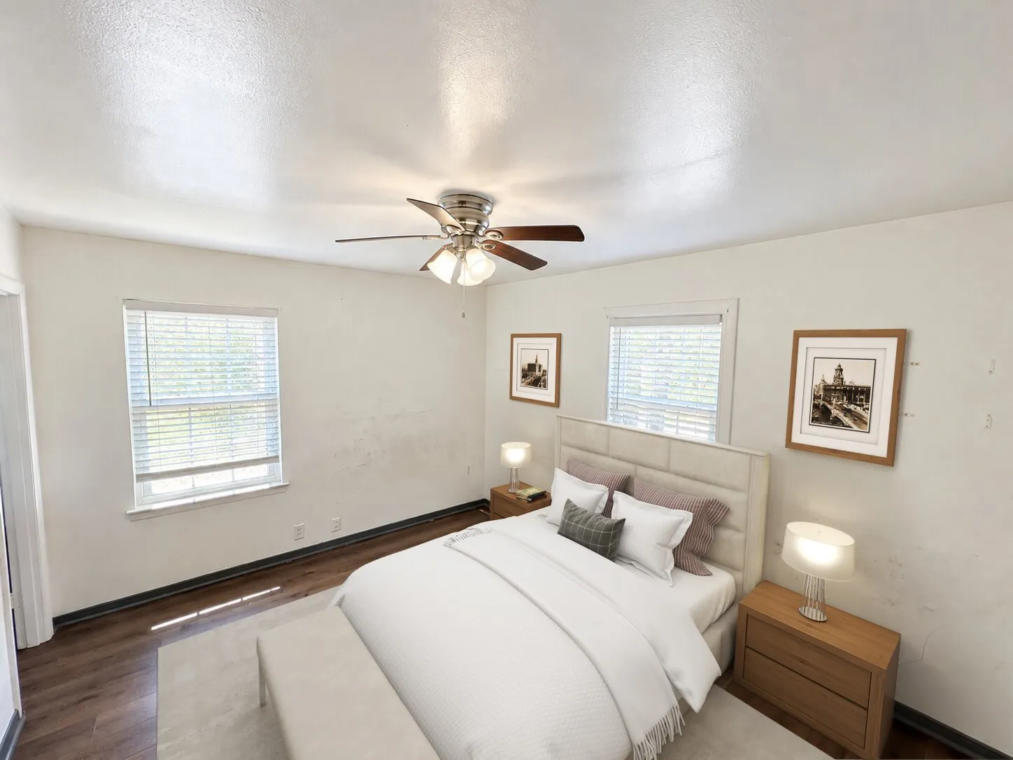 Virtually staged -
Wood-finish flooring, two windows with blinds, and a ceiling fan with integrated lighting