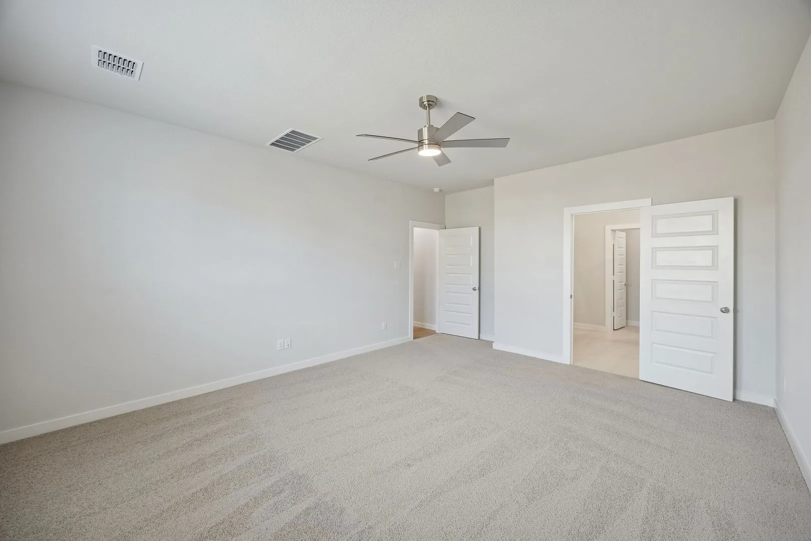 Primary Suite in the Masters home plan by Trophy Signature Homes – REPRESENTATIVE PHOTO