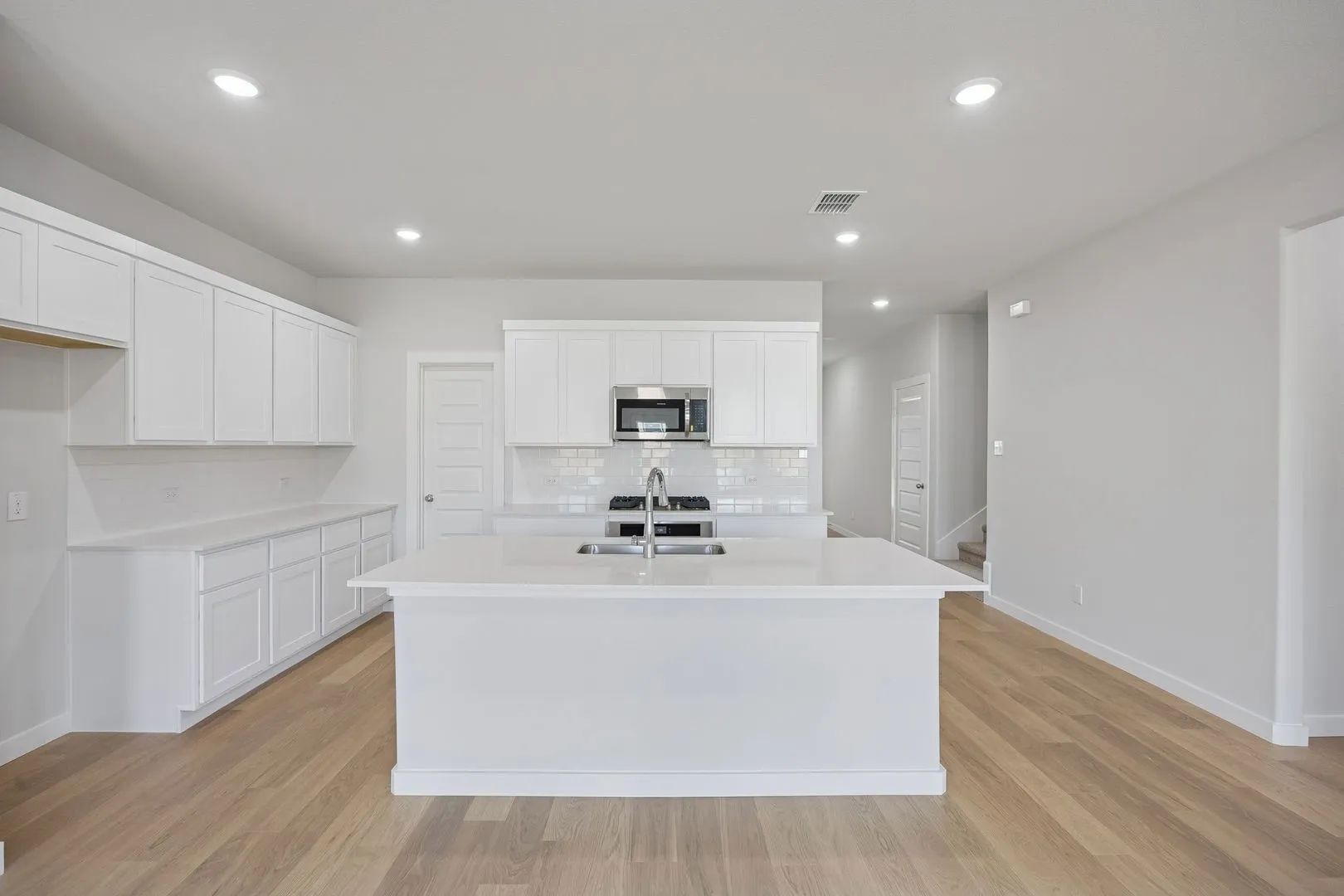 Kitchen in the Masters home plan by Trophy Signature Homes – REPRESENTATIVE PHOTO