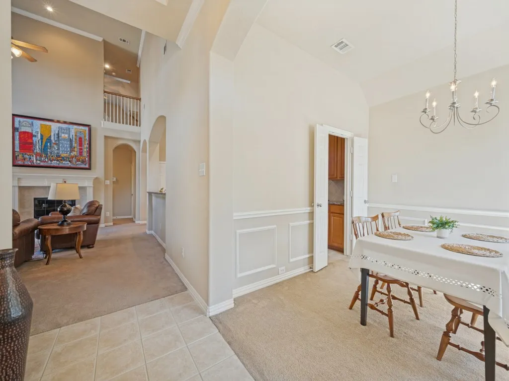 From the moment you enter, the home makes a beautiful first impression, with the dining room to the right and the spacious living room ahead, featuring soaring ceilings that create an impressive sense of openness.