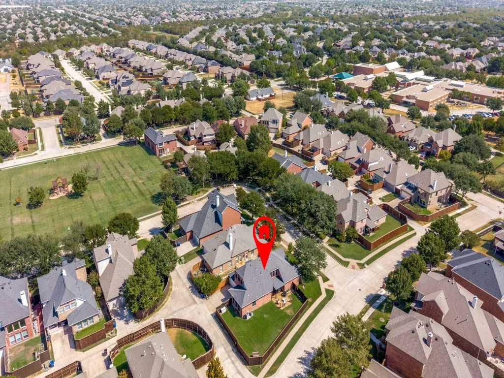 An aerial view highlights the home’s convenient location near the elementary school and neighborhood park, showcasing easy access to both for everyday enjoyment.