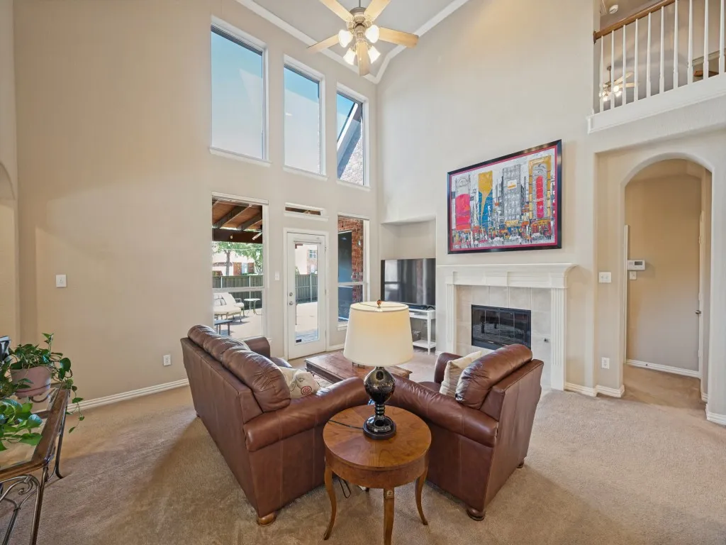 The living room is anchored by a beautiful fireplace, creating a warm and inviting focal point for relaxing and gathering with family and friends.