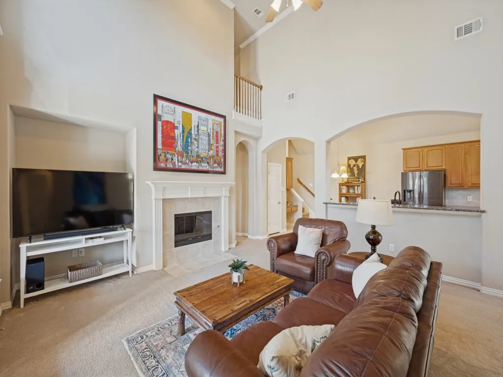 The living room is thoughtfully positioned adjacent to the kitchen, creating an open, connected space that is ideal for everyday living and entertaining.