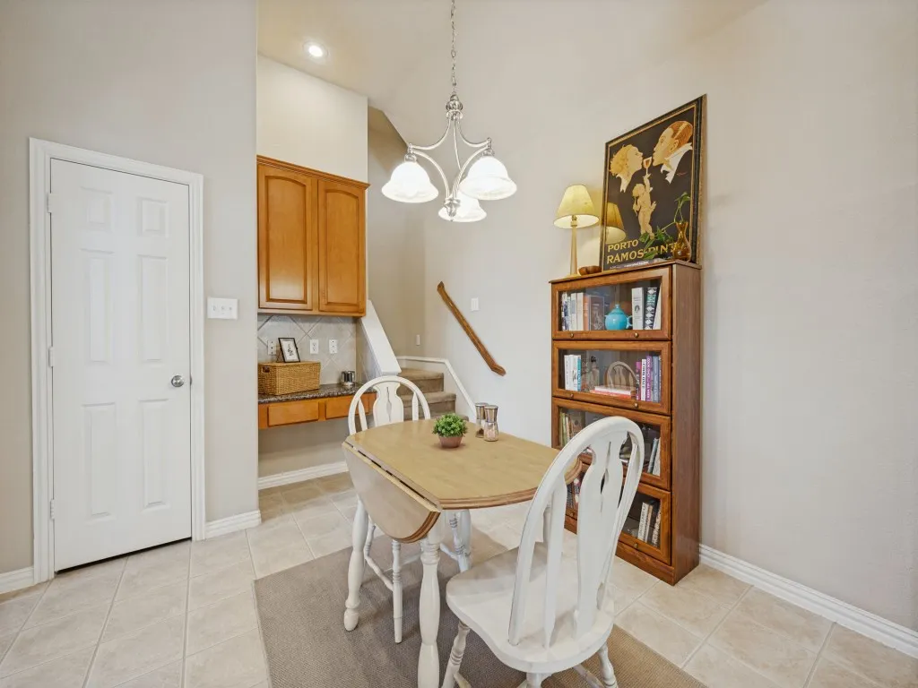 A cozy breakfast area adjoins the kitchen, offering a convenient spot for casual meals and morning coffee.