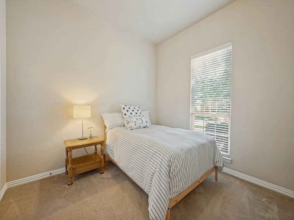 This well-sized 11x12 bedroom is located at the front of the home and features a double-door closet, offering comfortable living space and convenient storage.