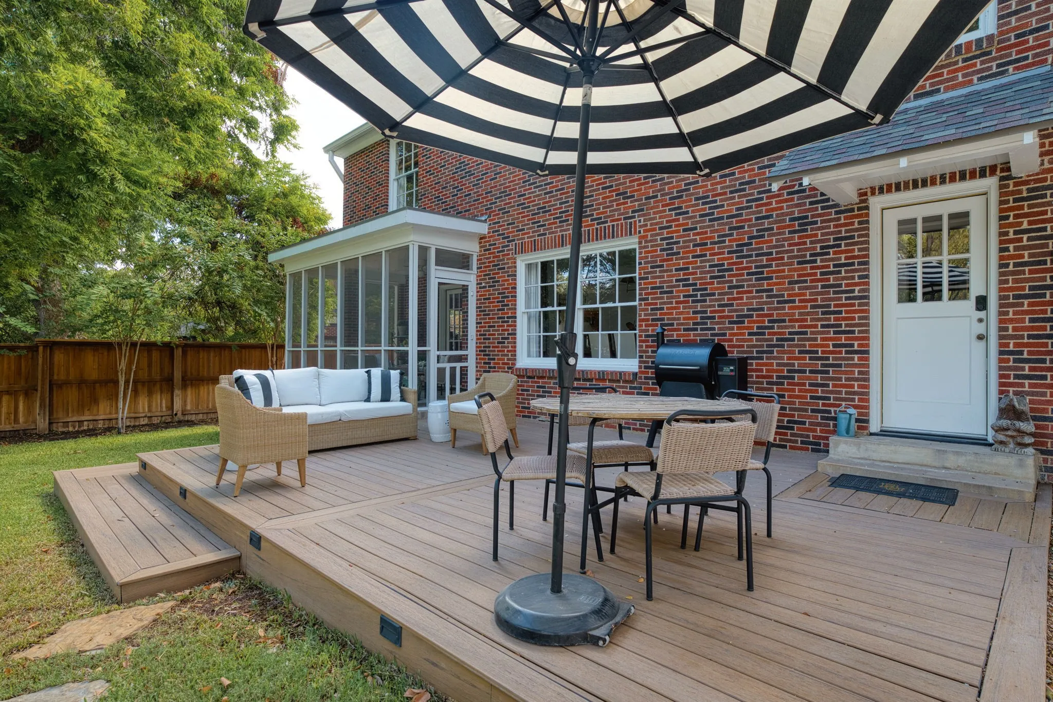 Spacious rear deck with multi-level design and integrated lighting
