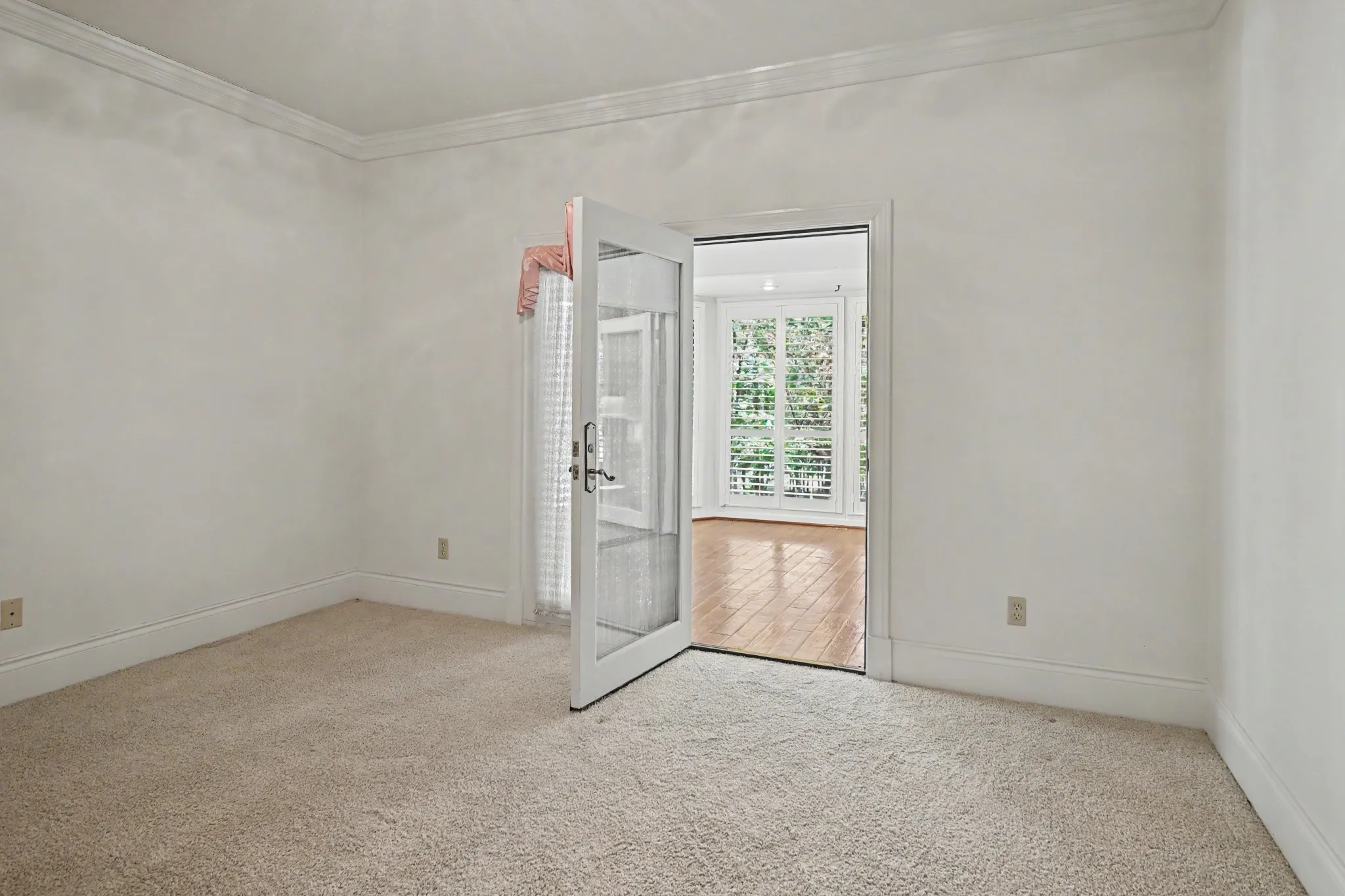 Secondary bedroom  with door leading out the garden room