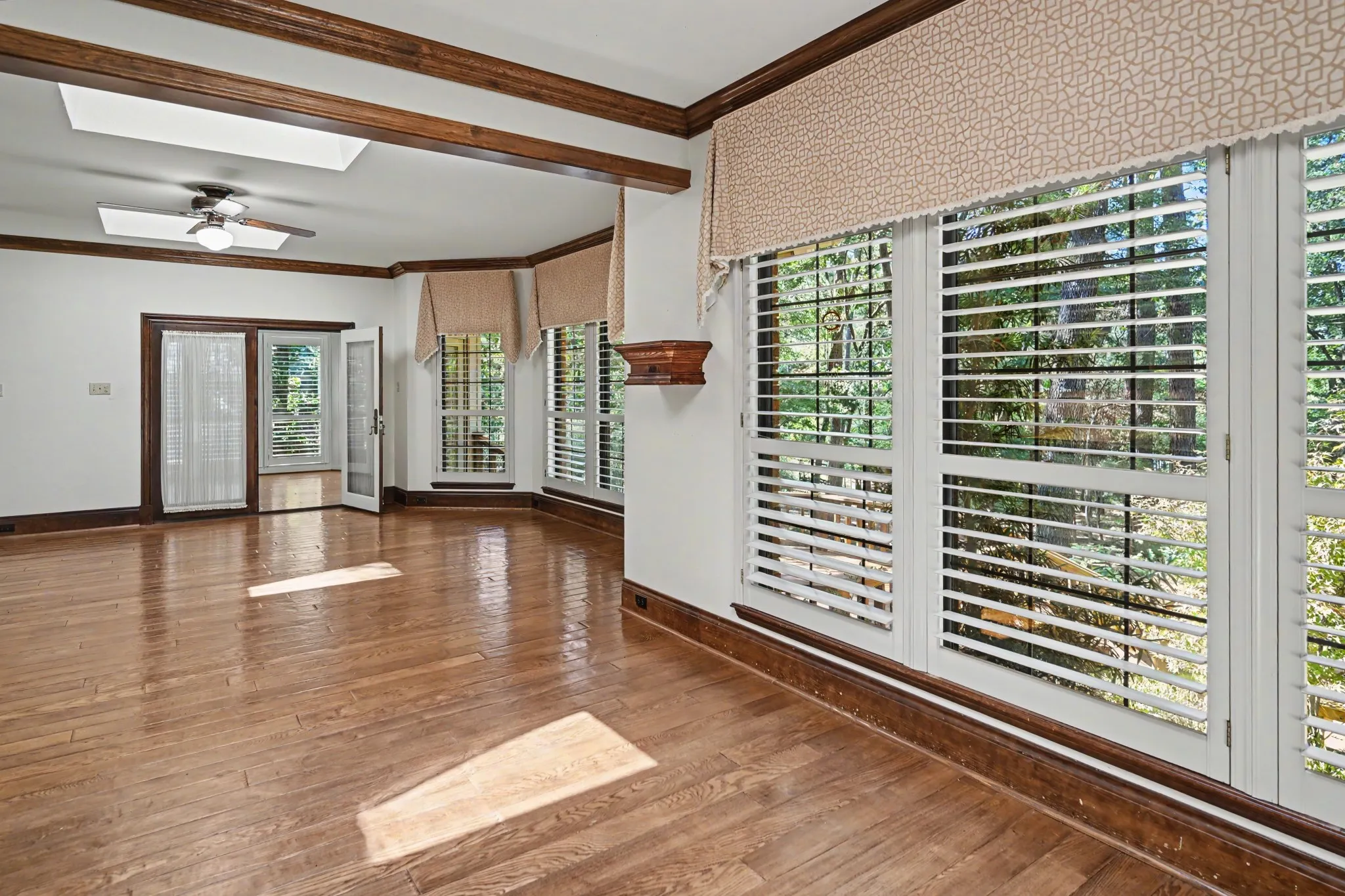 Family room with 2 skylights and windows overlooking lot