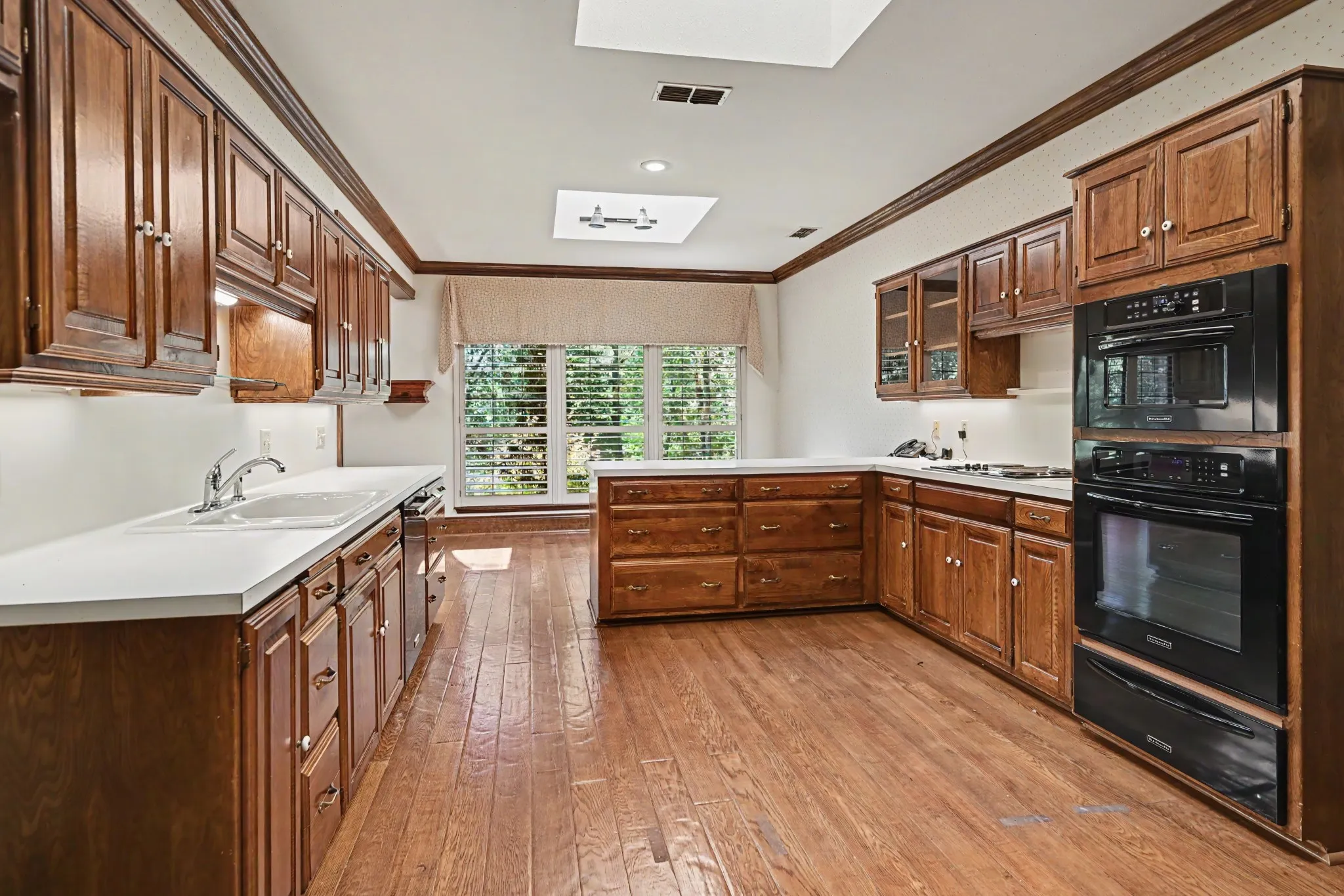 Huge kitchen has tons of cabinets and drawers