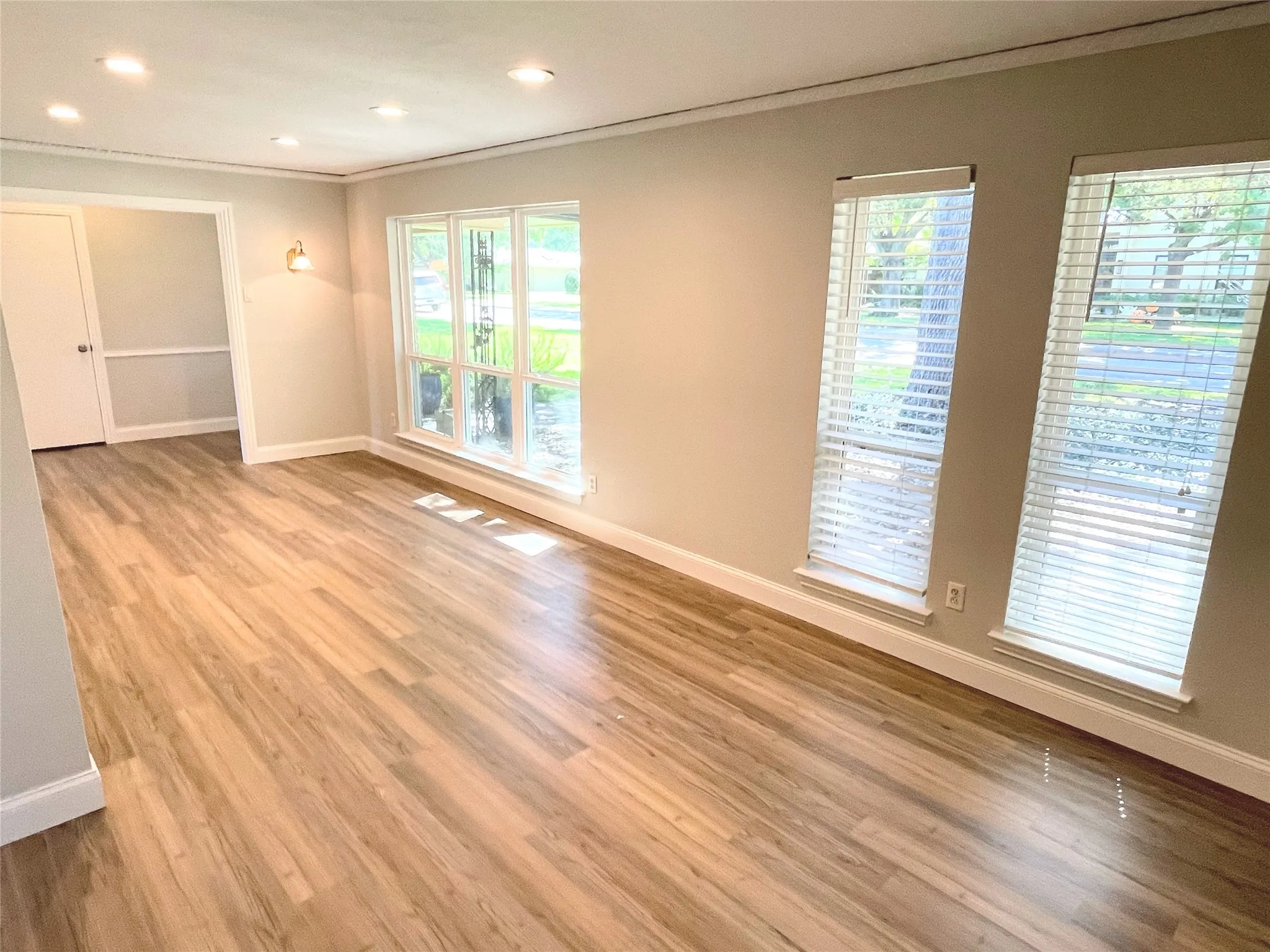 Dining room featuring light hardwood / wood-style floors and crown molding