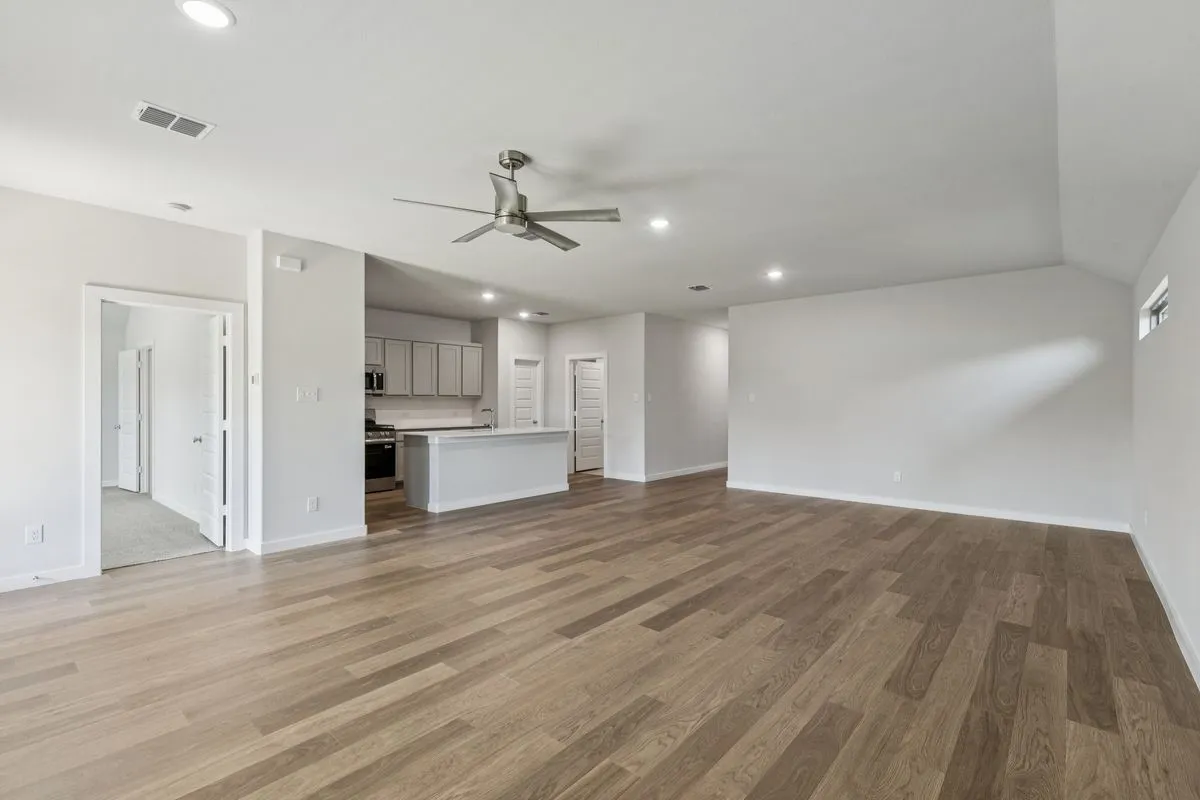 Open Floor Plan in the Oscar home plan by Trophy Signature Homes – REPRESENTATIVE PHOTO