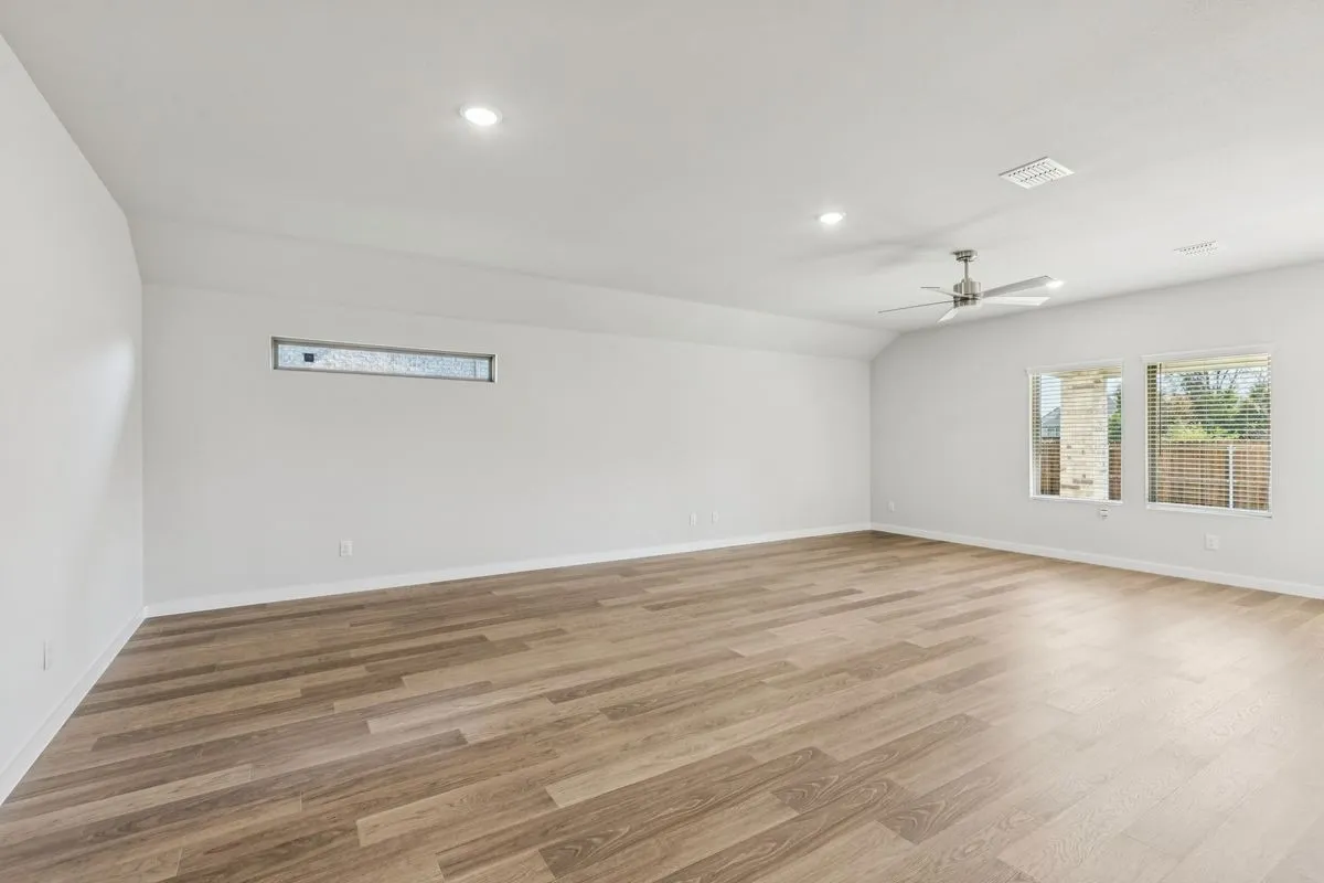Living and Dining Rooms in the Oscar home plan by Trophy Signature Homes – REPRESENTATIVE PHOTO
