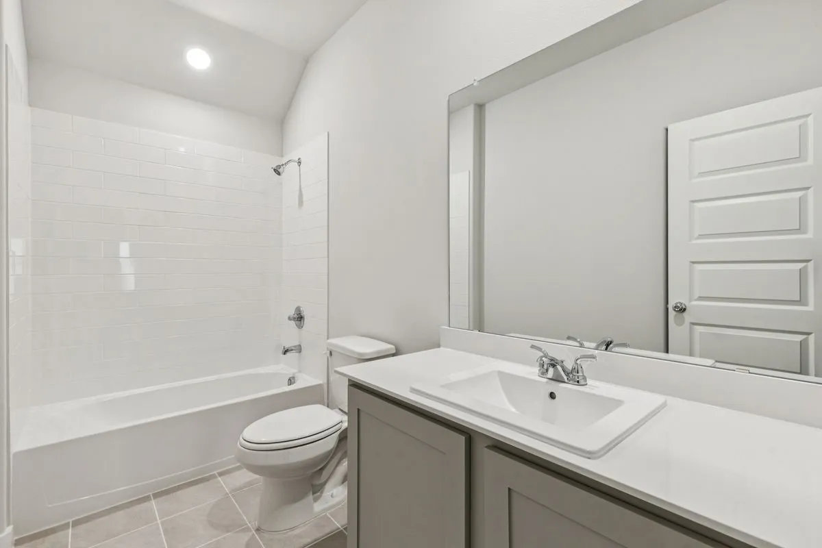 Bathroom in the Oscar home plan by Trophy Signature Homes – REPRESENTATIVE PHOTO