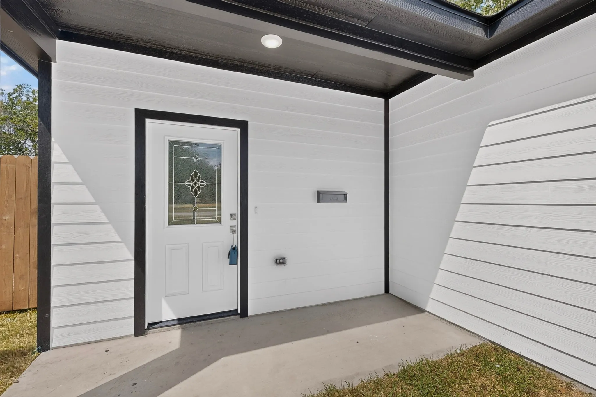 White horizontal siding with contrasting black trim