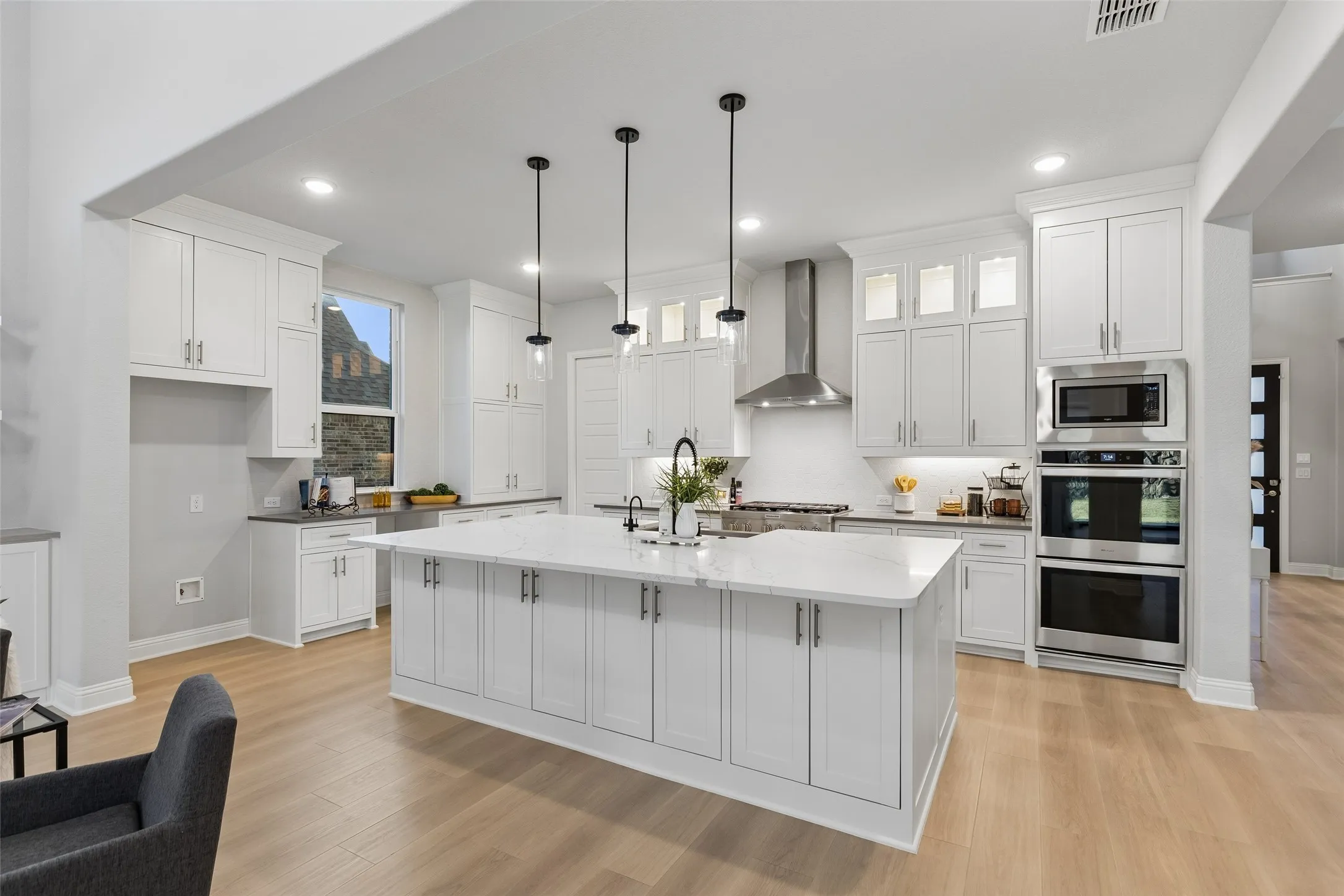 With upgraded appliances, all the cabinets and countertop space you'll need, you'll also discover an ample-sized walk-in pantry behind the pocket door!