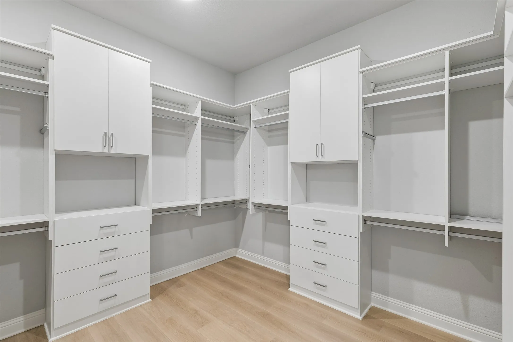 If you do, you'll want to find yourself in this perfectly organized Primary Closet, which also connects to the laundry room.