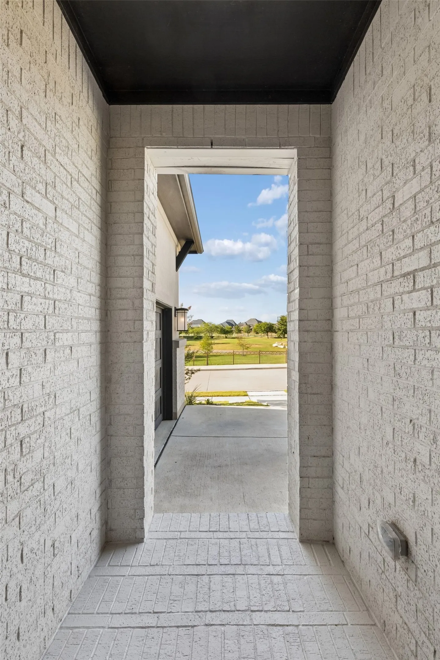 Even the view through the entry frames what makes this homesite special—open green space directly across the street.