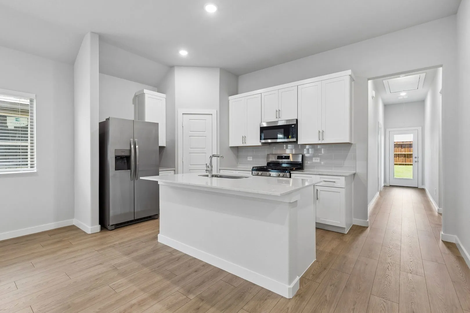 Kitchen in the Cypress home plan by Trophy Signature Homes - REPRESENTATIVE PHOTO