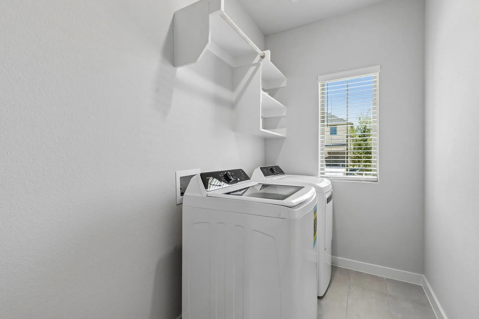 Utility Room in the Cypress home plan by Trophy Signature Homes - REPRESENTATIVE PHOTO