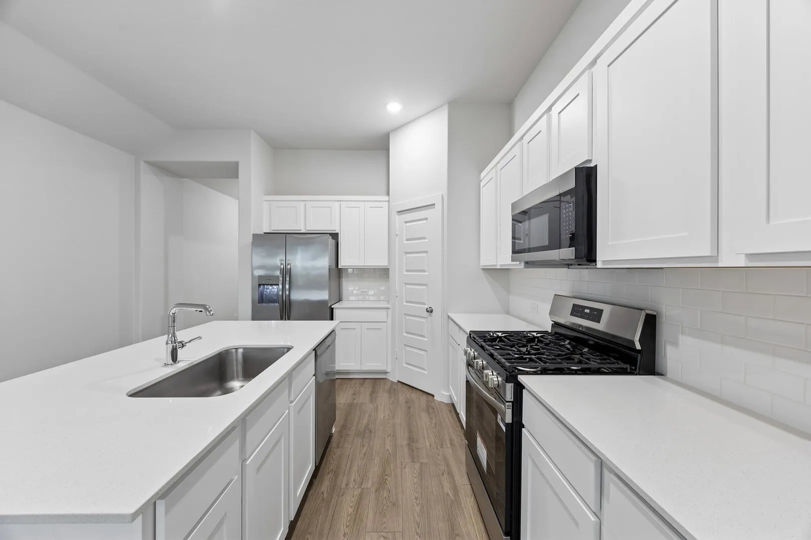 Kitchen in the Cedar home plan by Trophy Signature Homes – REPRESENTATIVE PHOTO