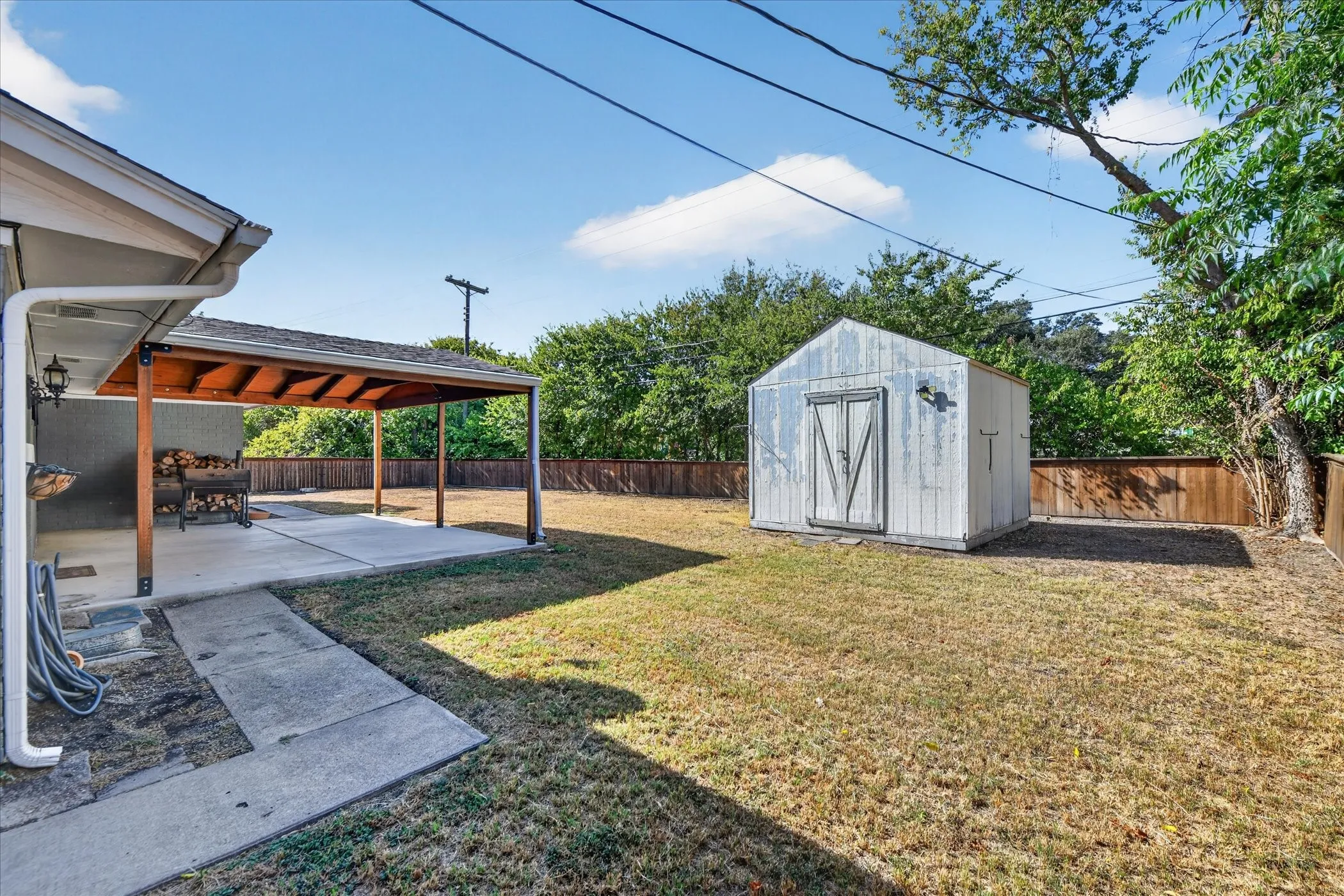 Large back yard with storage shed