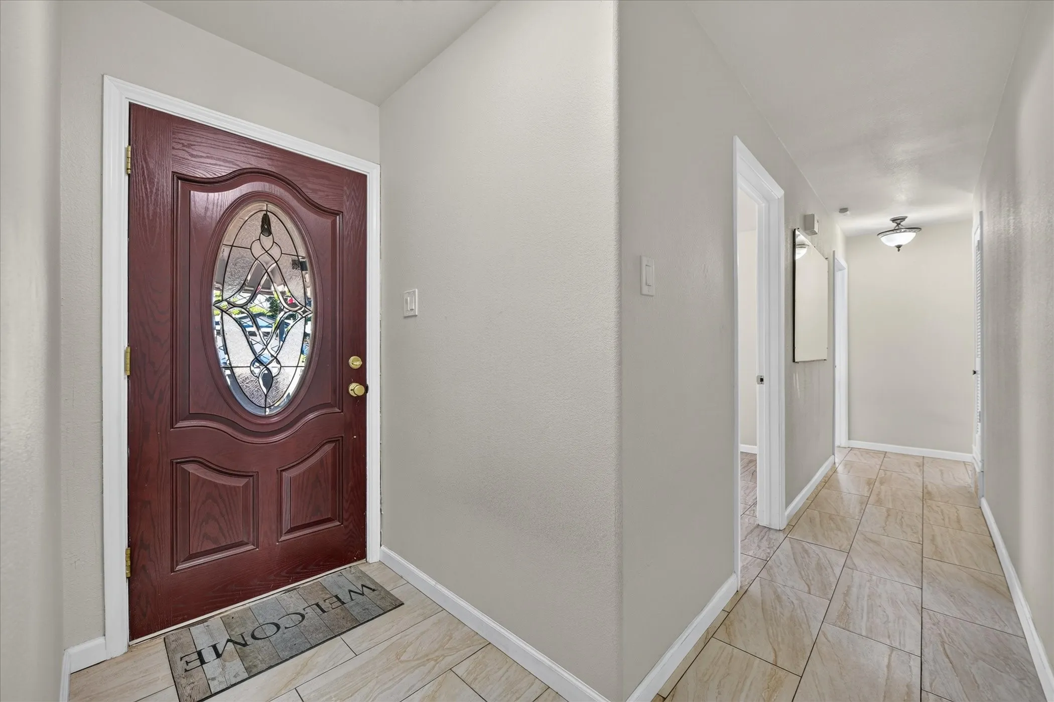 Entryway with hall to bedrooms