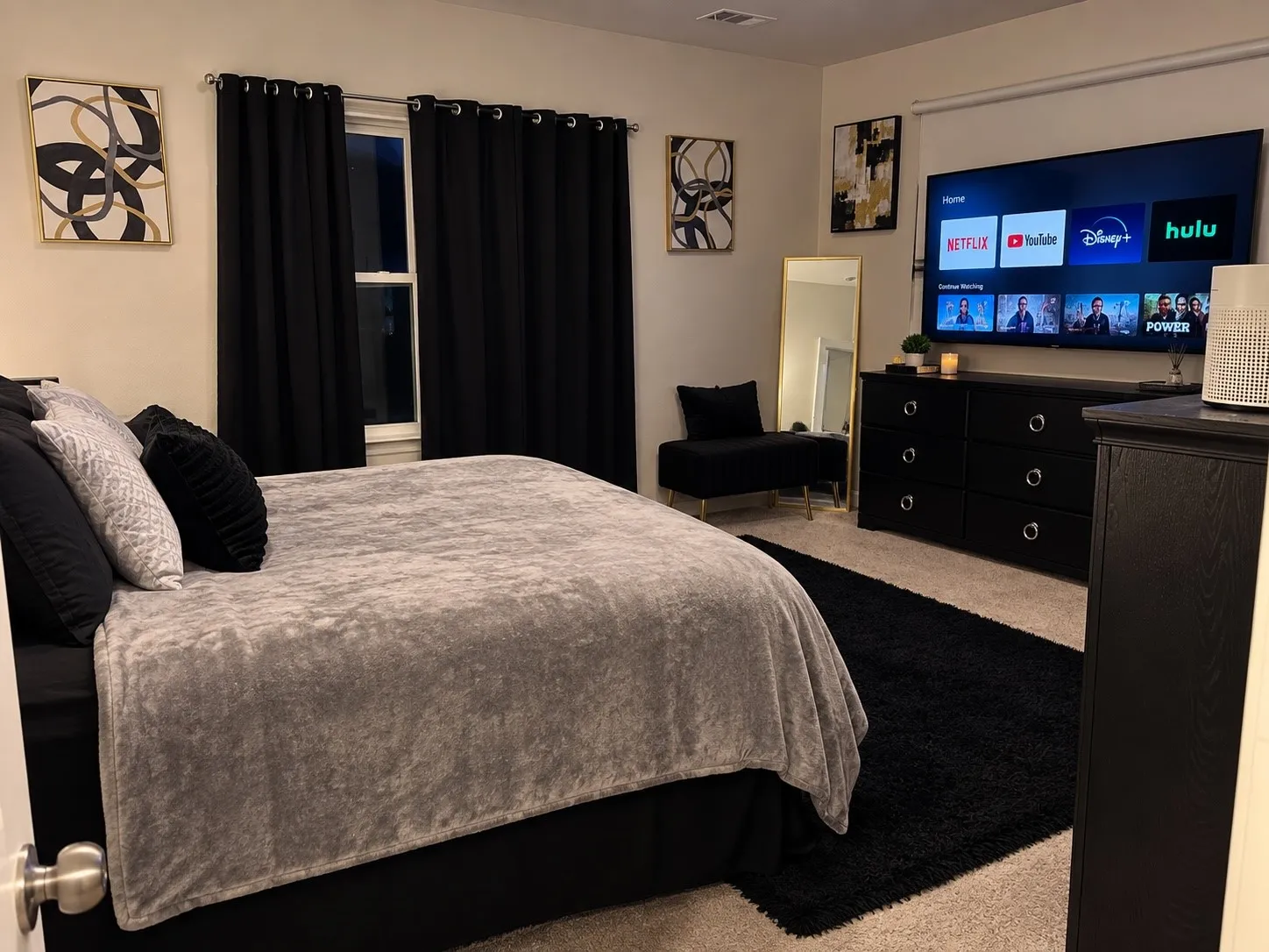 Carpeted flooring, recessed lighting, and a single window with curtain rods