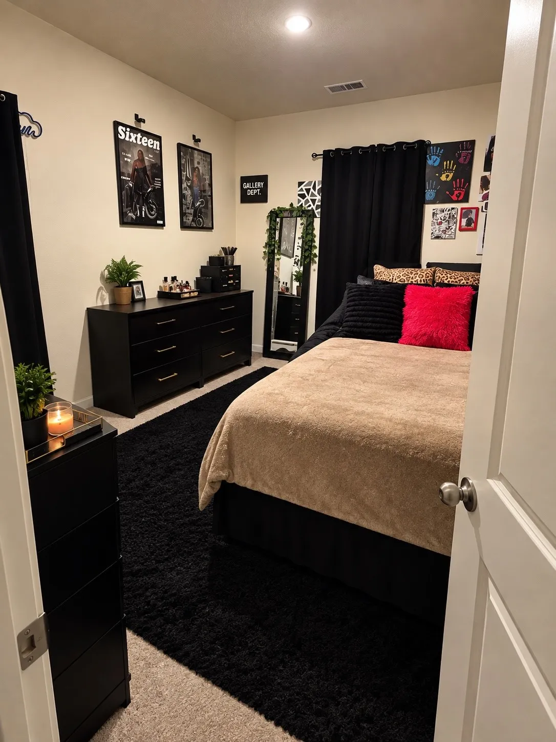 Recessed lighting, wood-finish dresser, full-length mirror, black curtain rods, and a black area rug