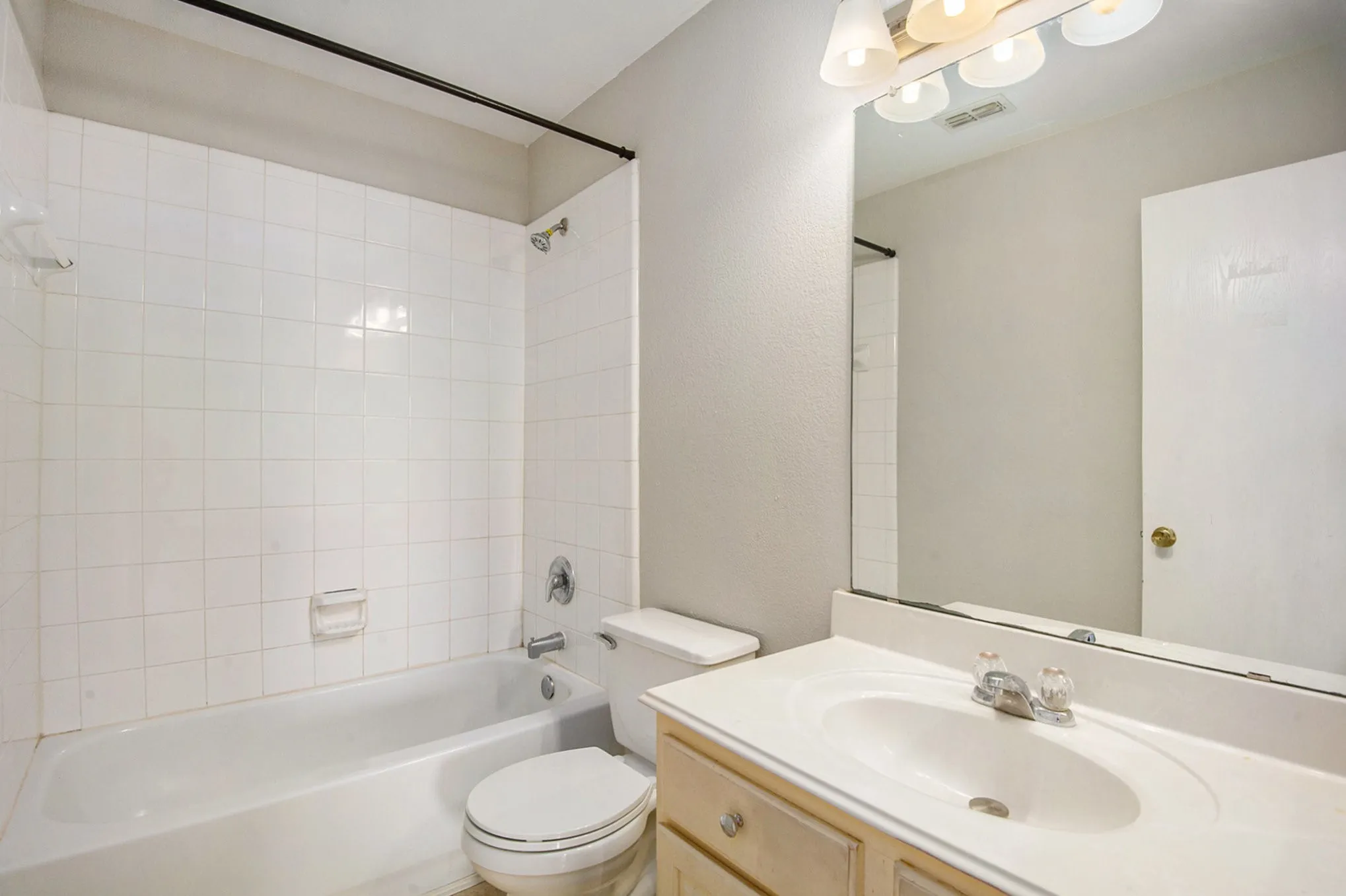 Full bath featuring shower / bathtub combination and vanity