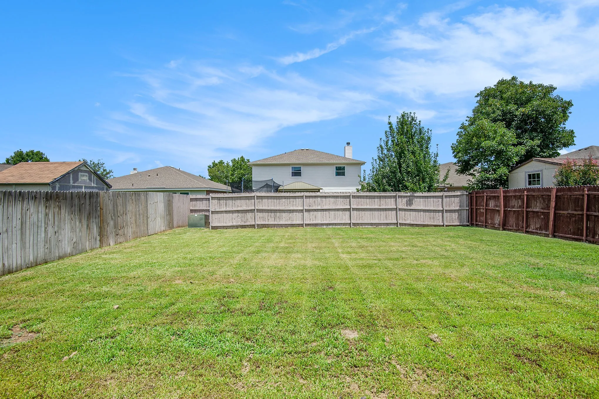 View of fenced backyard