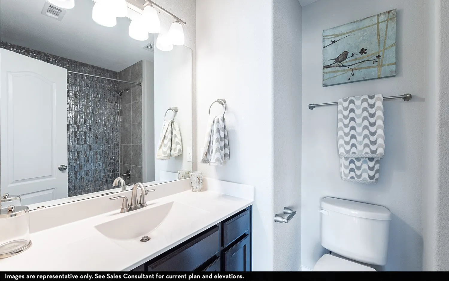 Vanity with undermount sink, brushed nickel faucet, and white countertop