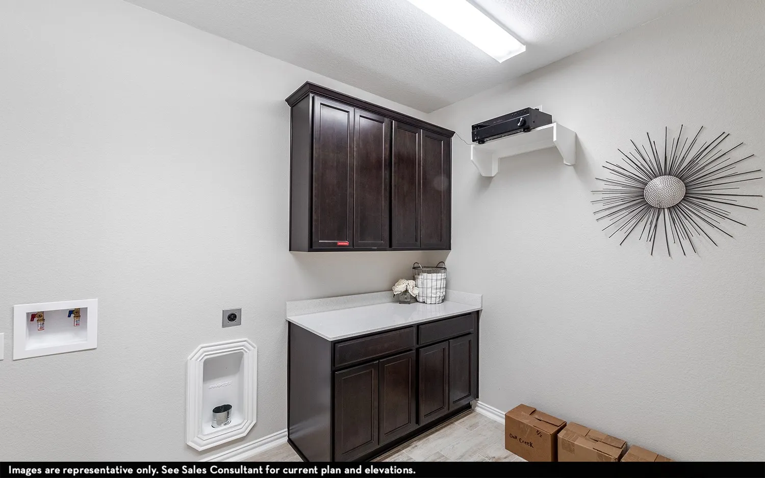 Built-in cabinetry with dark wood-finish doors, solid surface countertop, and wood-finish flooring