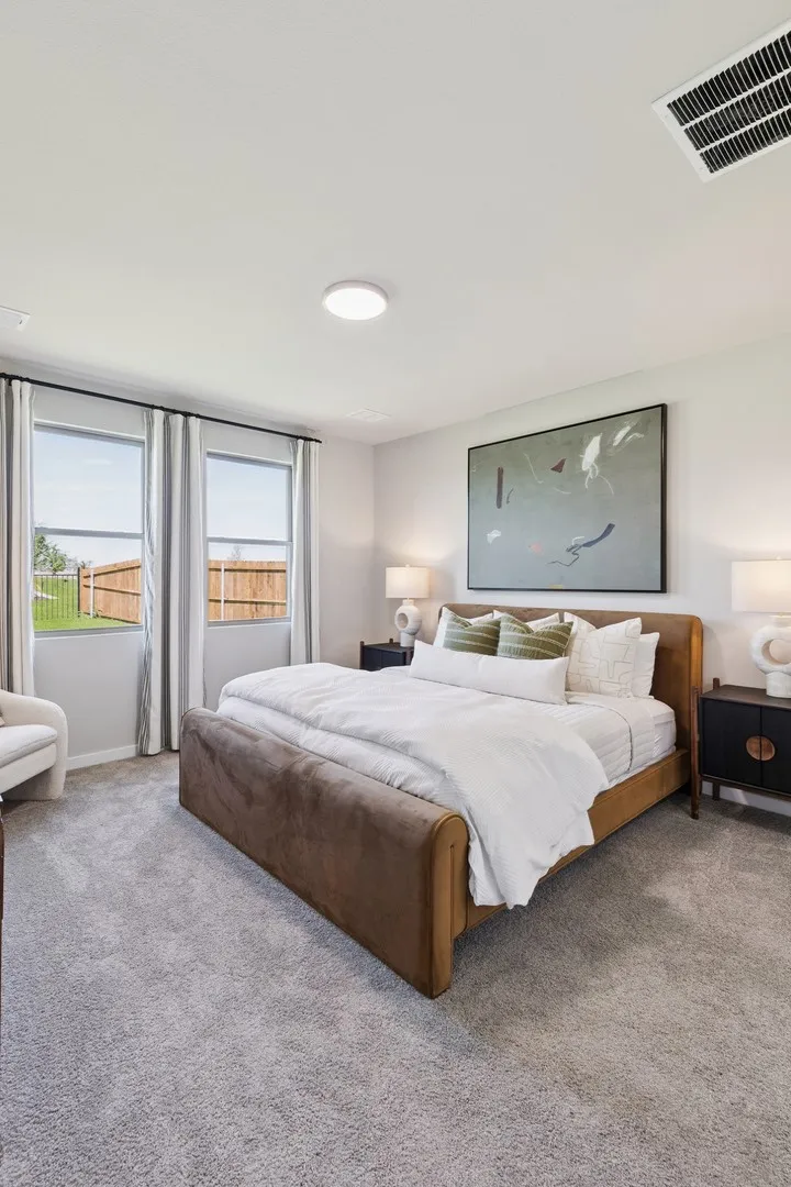 Primary Suite in the Magnolia home plan by Trophy Signature Homes – REPRESENTATIVE PHOTO
