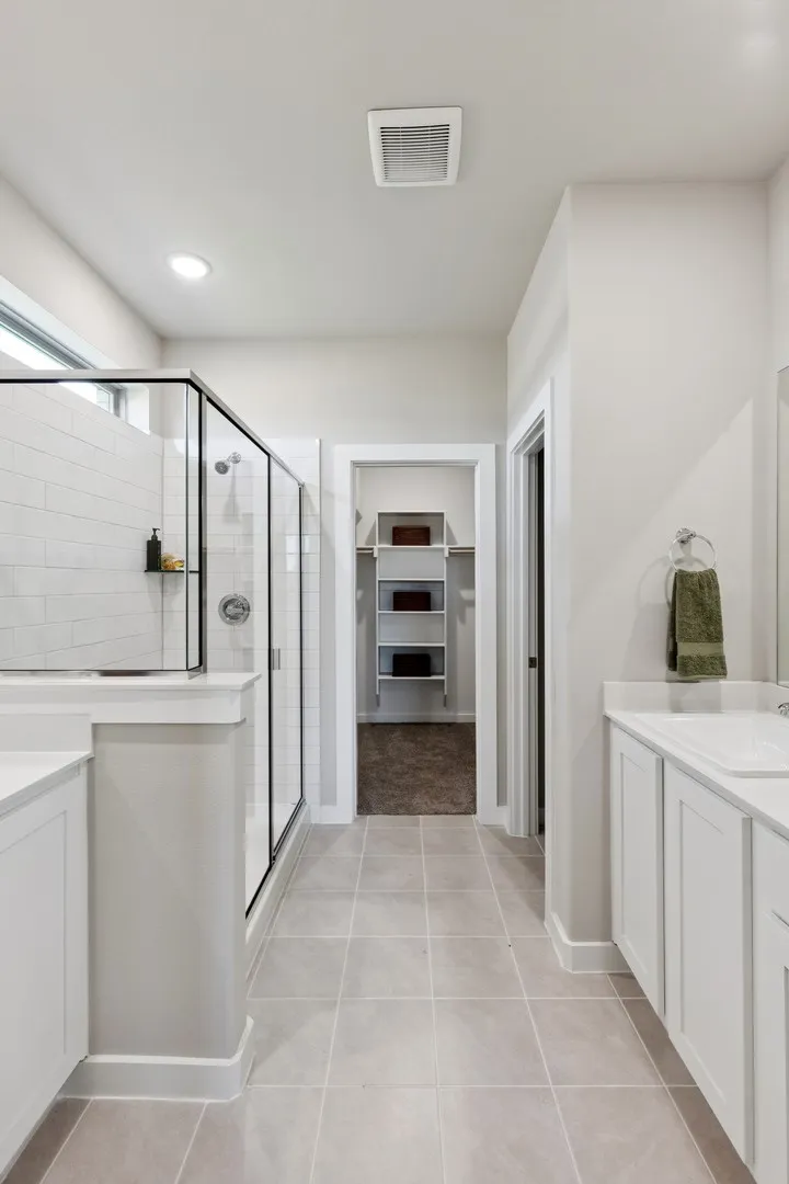 Primary Bathroom in the Magnolia home plan by Trophy Signature Homes – REPRESENTATIVE PHOTO