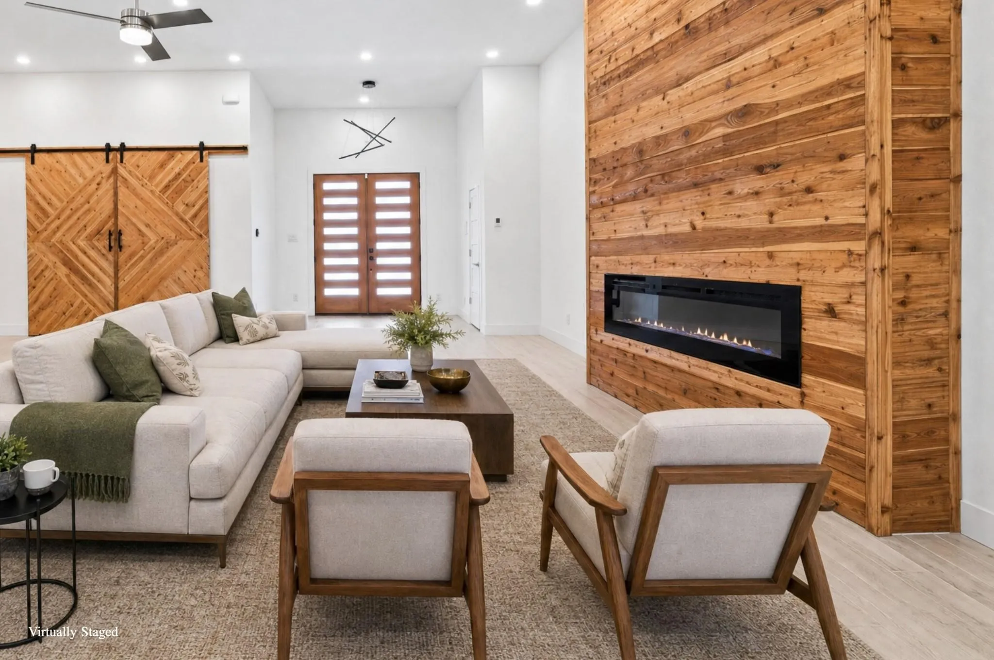 Integrated linear fireplace with a wood-paneled accent wall, wood-finish flooring, recessed lighting, and a modern ceiling fan