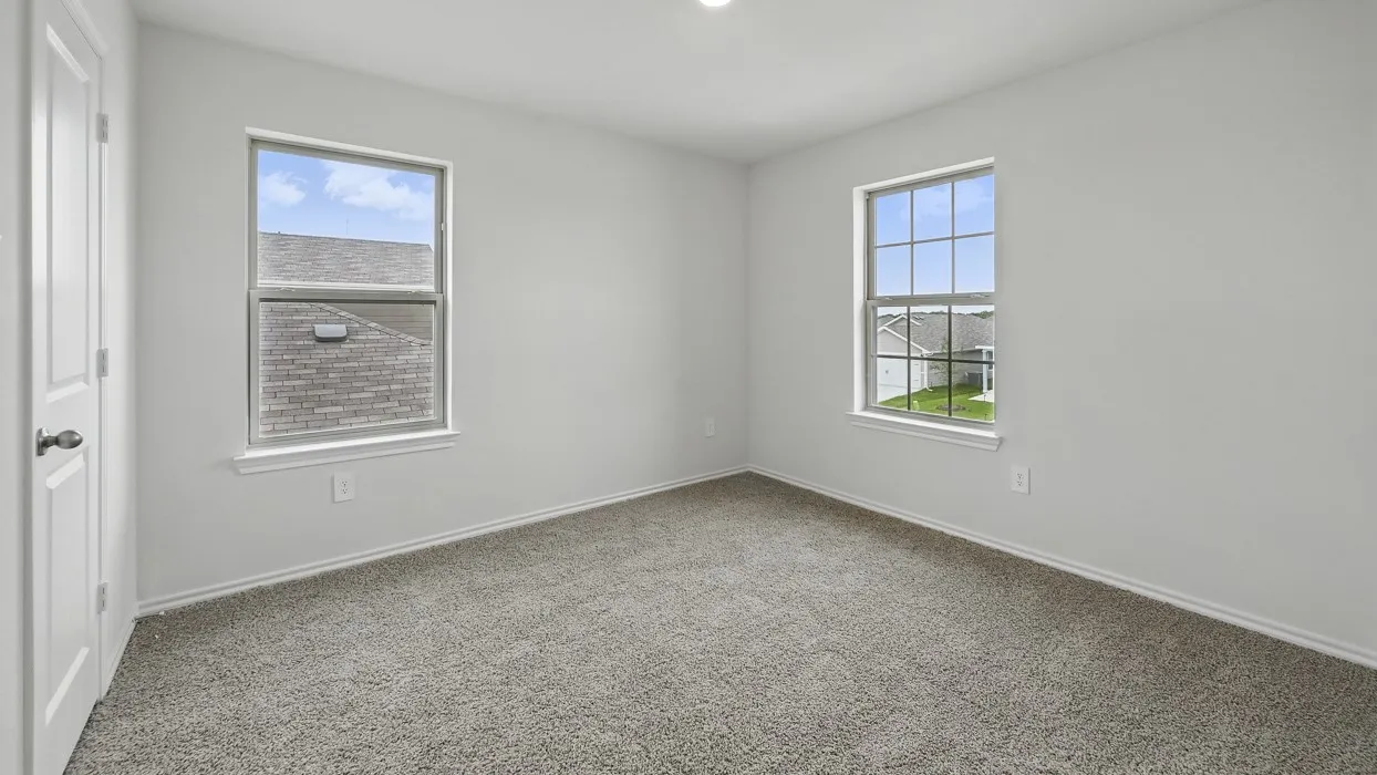 Neutral-toned carpeting paired with light walls and trim