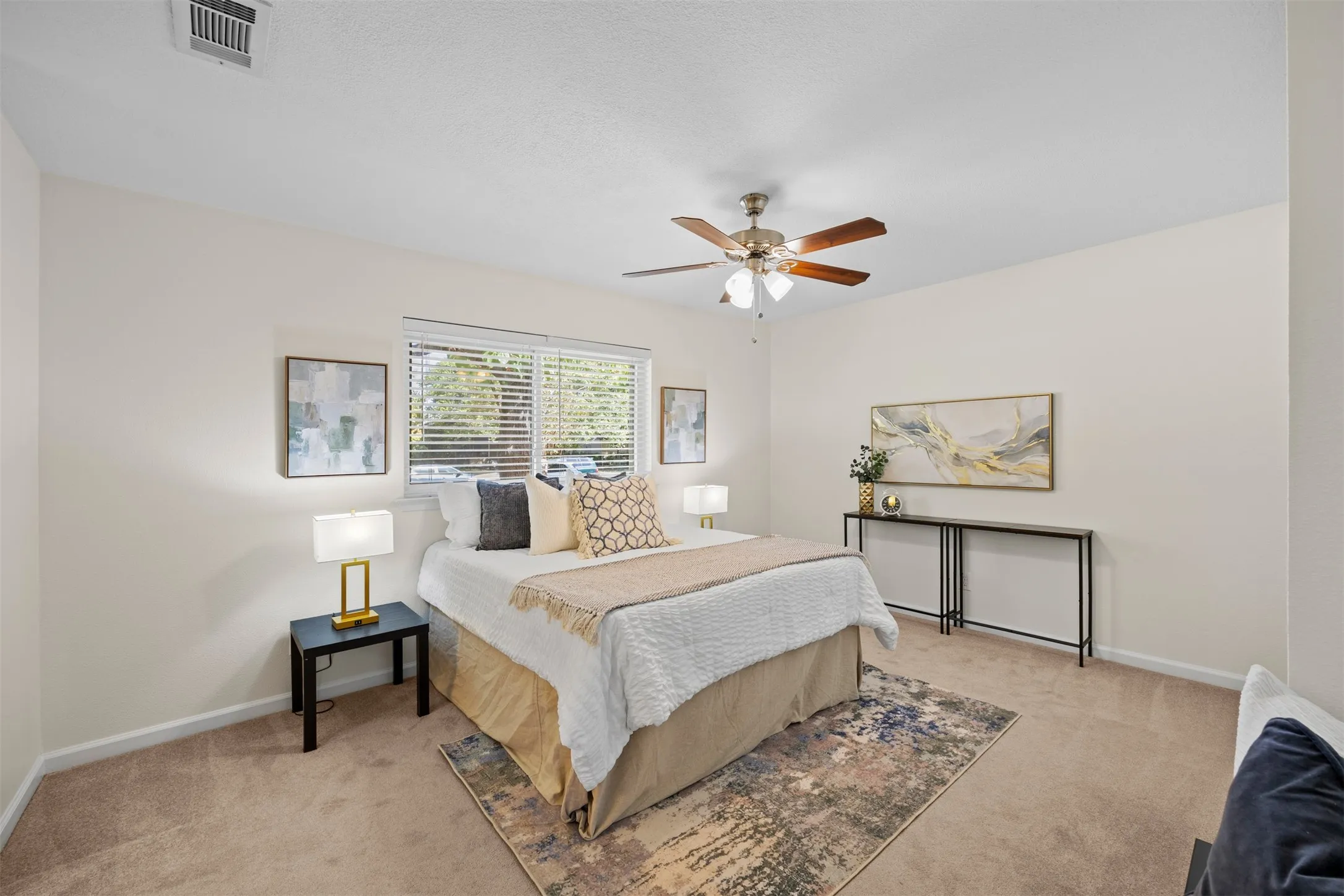 Recessed window with horizontal blinds, ceiling fan with integrated lighting, wall-to-wall carpeting, and neutral wall tones