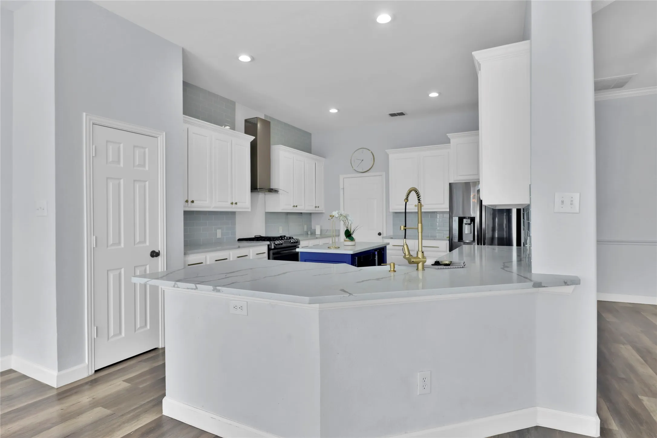 Kitchen with island and lots of counter prep space.