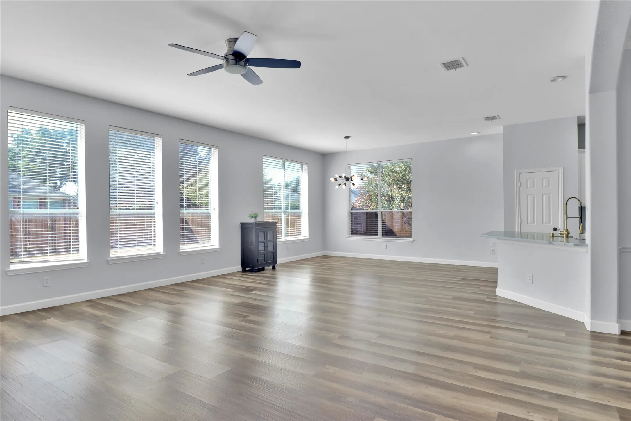 Living room is open to breakfast area and kitchen and then dining room to right.