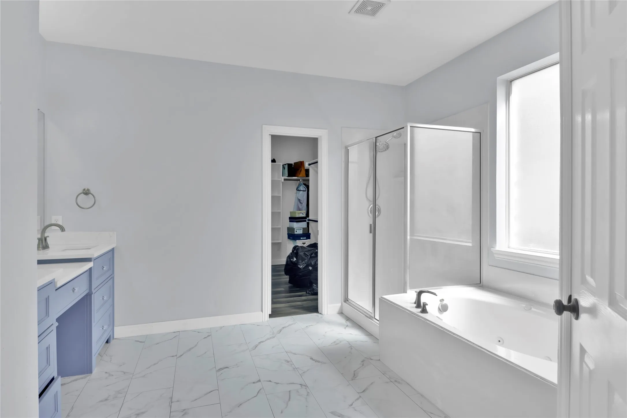 Master bath with separate shower an jetted tub.