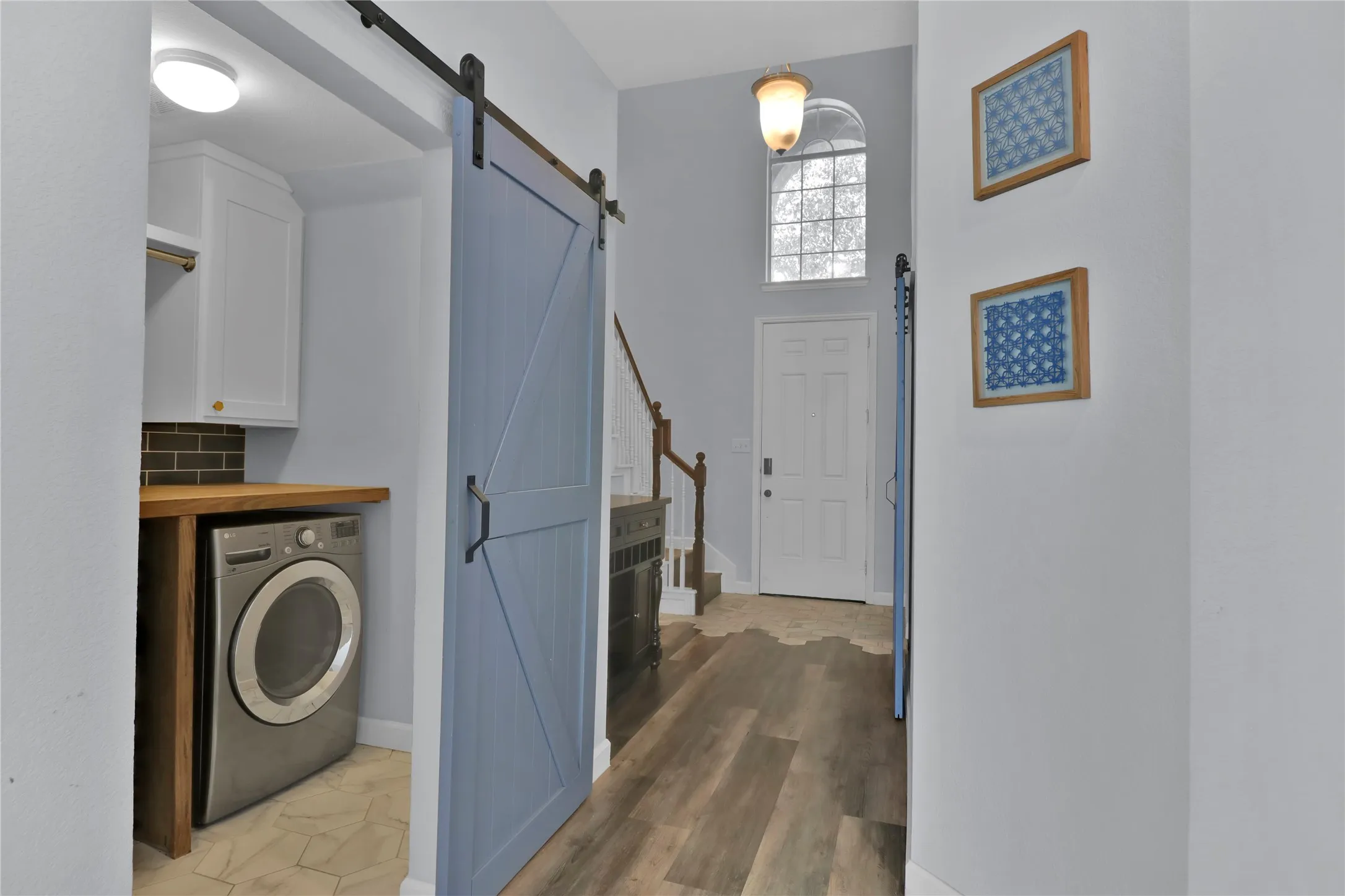 Barn door on laundry room for easy access.