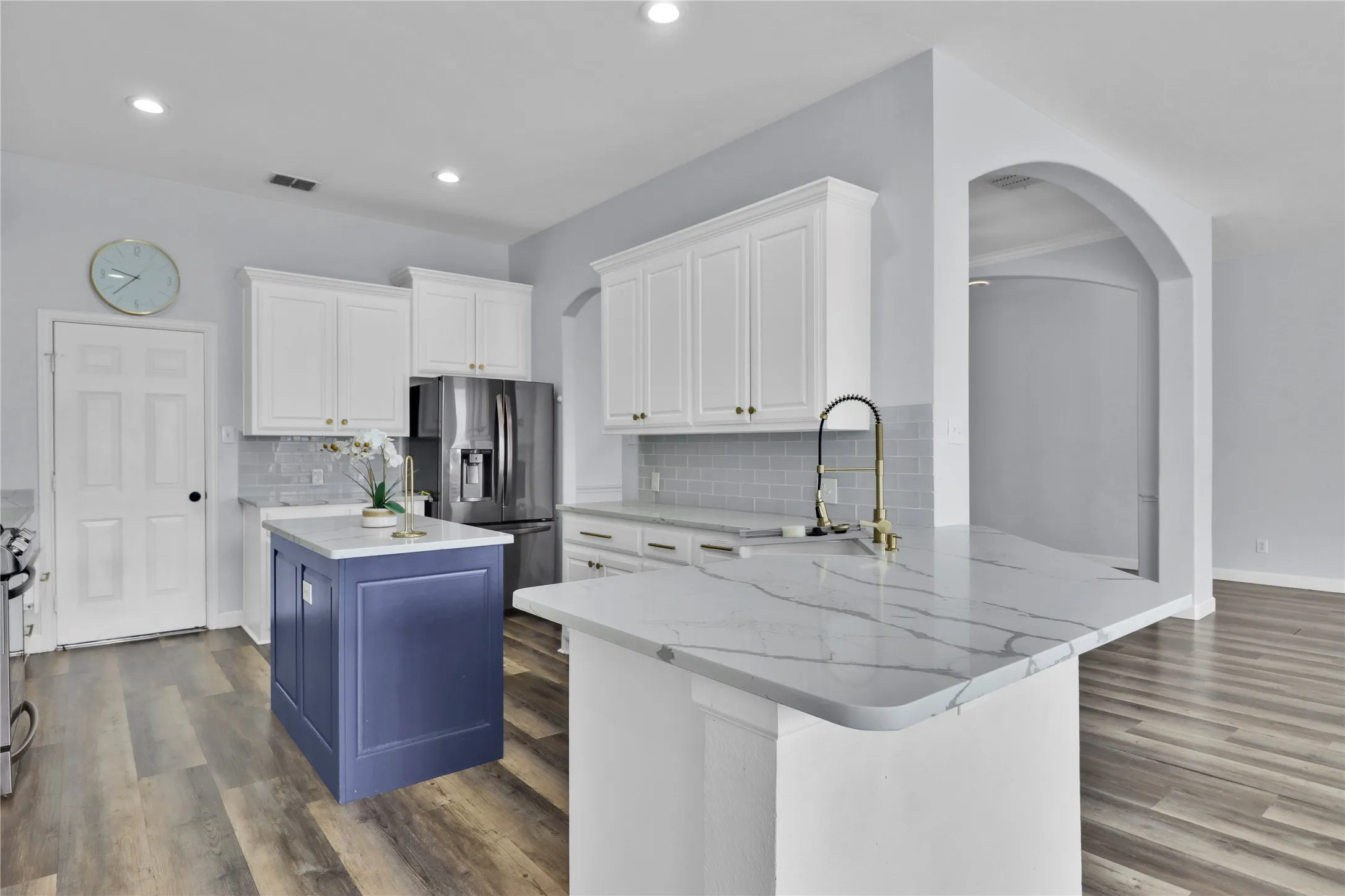 Island adds a pop of color to the kitchen.