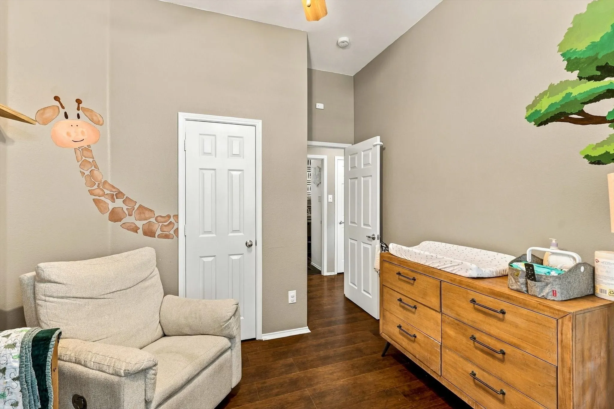 Wood-finish flooring, two panel doors, and vaulted ceilings
