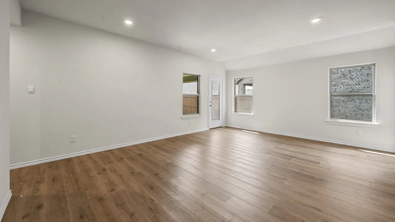 Wood-finish flooring throughout, complemented by recessed lighting