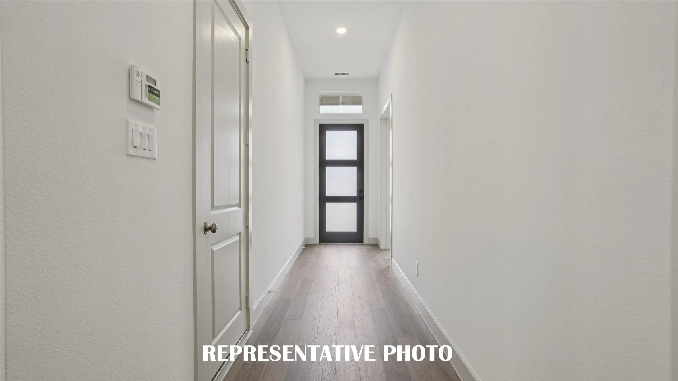 With ample wall space to display art work, this stylish entry area is the perfect place to welcome family and friends into your new home!  REPRESENTATIVE PHOTO
