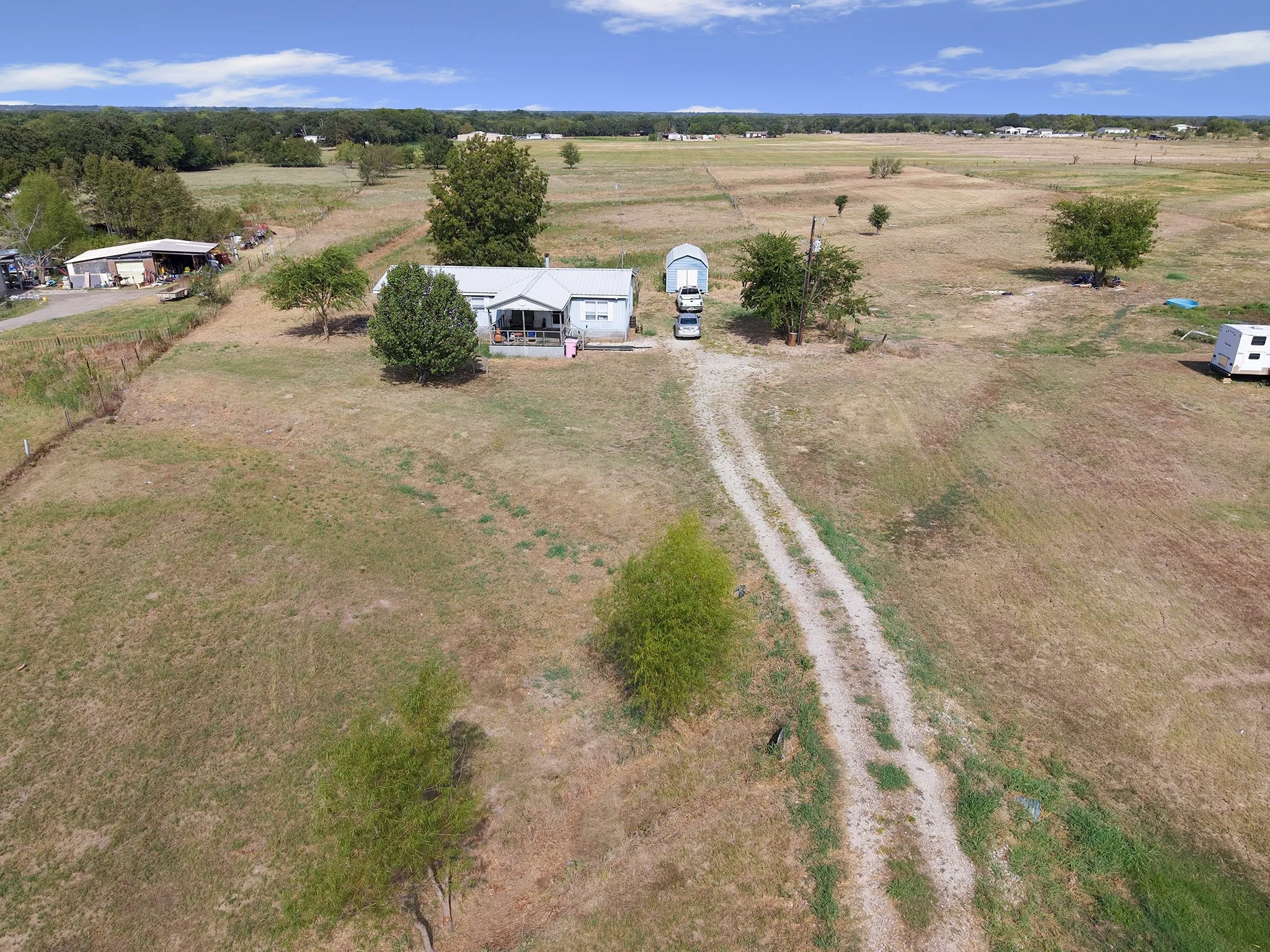 Expansive lot with a single-story residence and detached storage structure