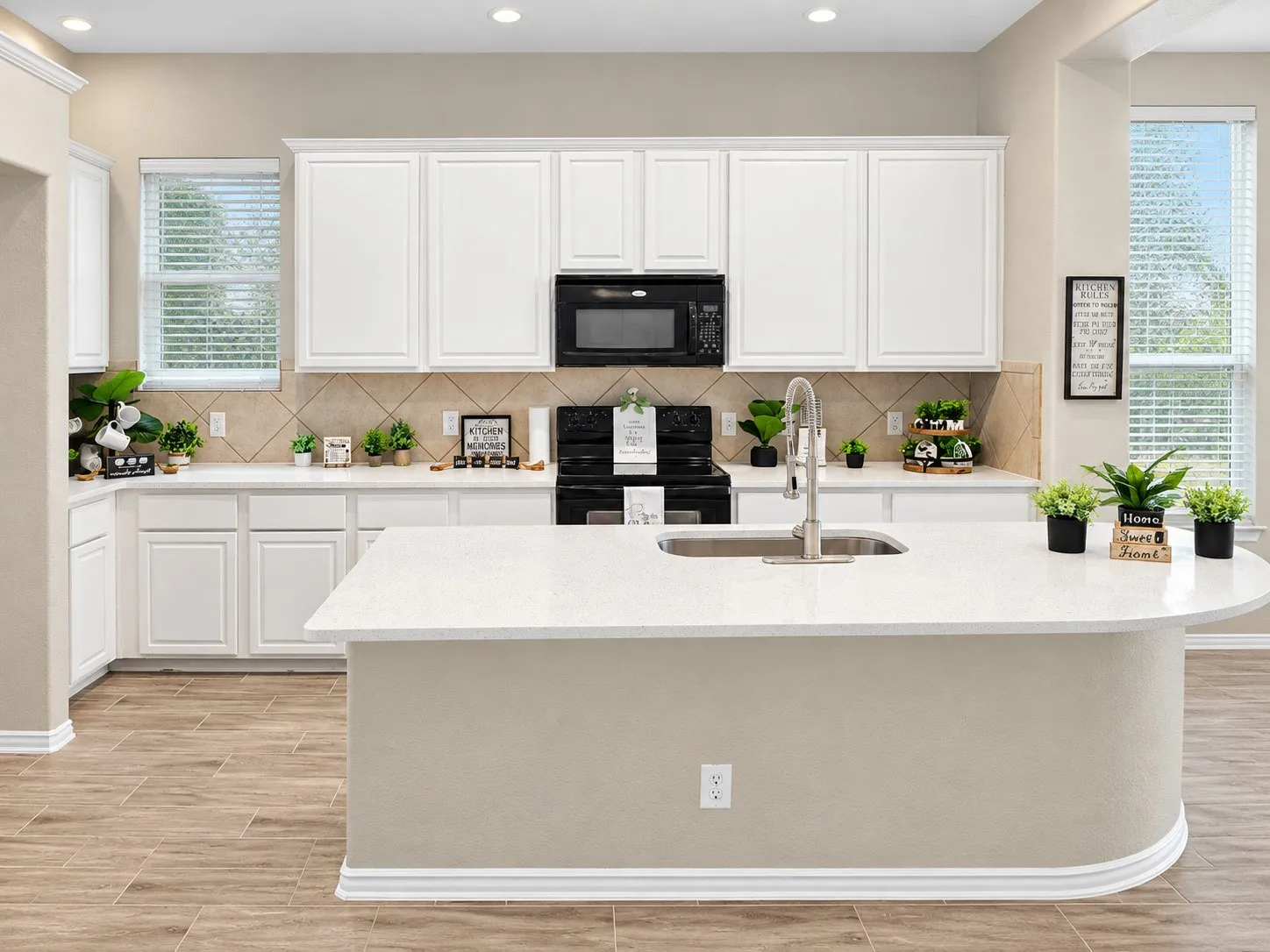 Kitchen featuring white shaker-style cabinetry, a built-in microwave, a tile backsplash, and wood-finish flooring