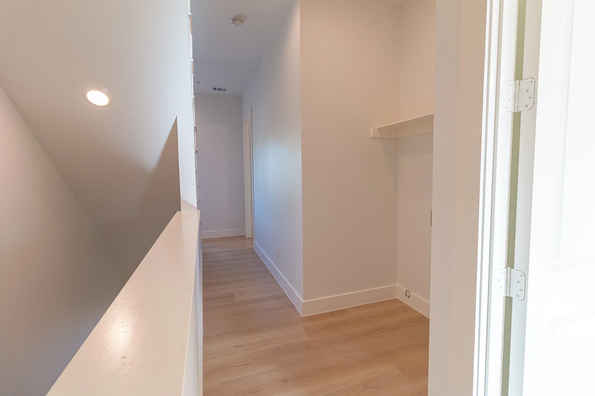 Corridor featuring light hardwood / wood-style flooring